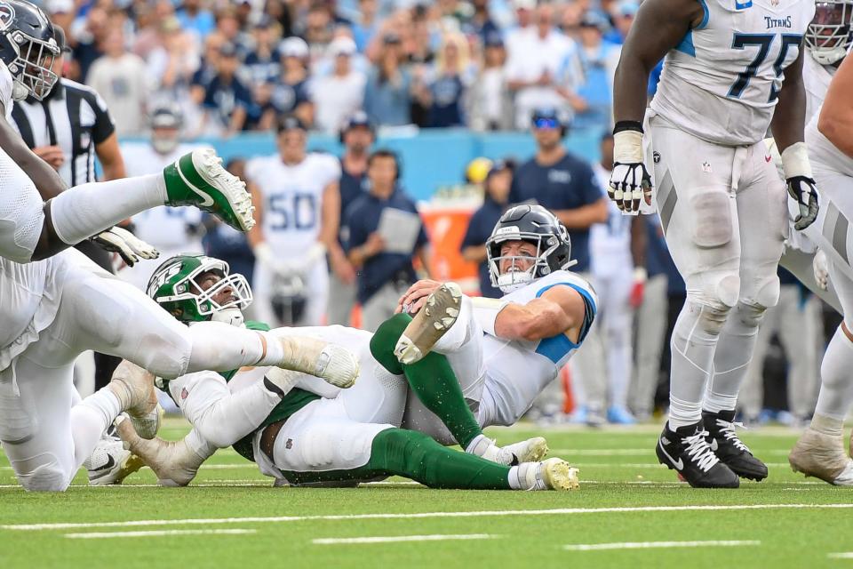 Sep 15, 2024; Nashville, Tennessee, USA; New York Jets defensive tackle Quinnen Williams (95) sacks Tennessee Titans Will Levis (8) during the second half at Nissan Stadium. Mandatory Credit: Steve Roberts-Imagn Images