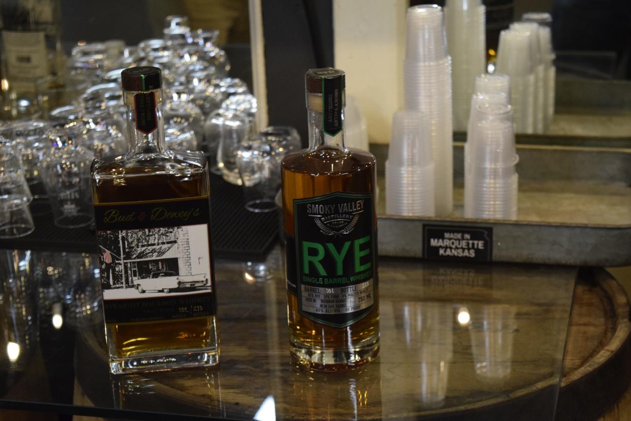 A bottle of Bud and Dewey's straight bourbon and a bottle of rye single barrel sit behind the bar at Smoky Valley Distillery in Marquette. After aging for at least two years, these two whiskeys are now available at the distillery and retailers around the state.