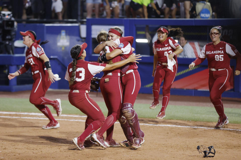 Oklahoma players celebrate after defeating Florida State in the NCAA Women's College World Series softball championship series Thursday, June 8, 2023, in Oklahoma City. (AP Photo/Nate Billings)