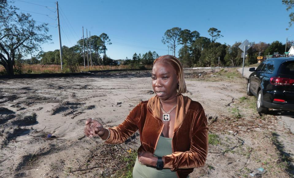 Lillie Lovett talks about enduring tough times in her life as she stands in front of the empty lot that will be the site of her family's new home. "When they say, ‘You live and learn,’ I’m one of those,” said Lovett, who is now a certified nursing assistant.