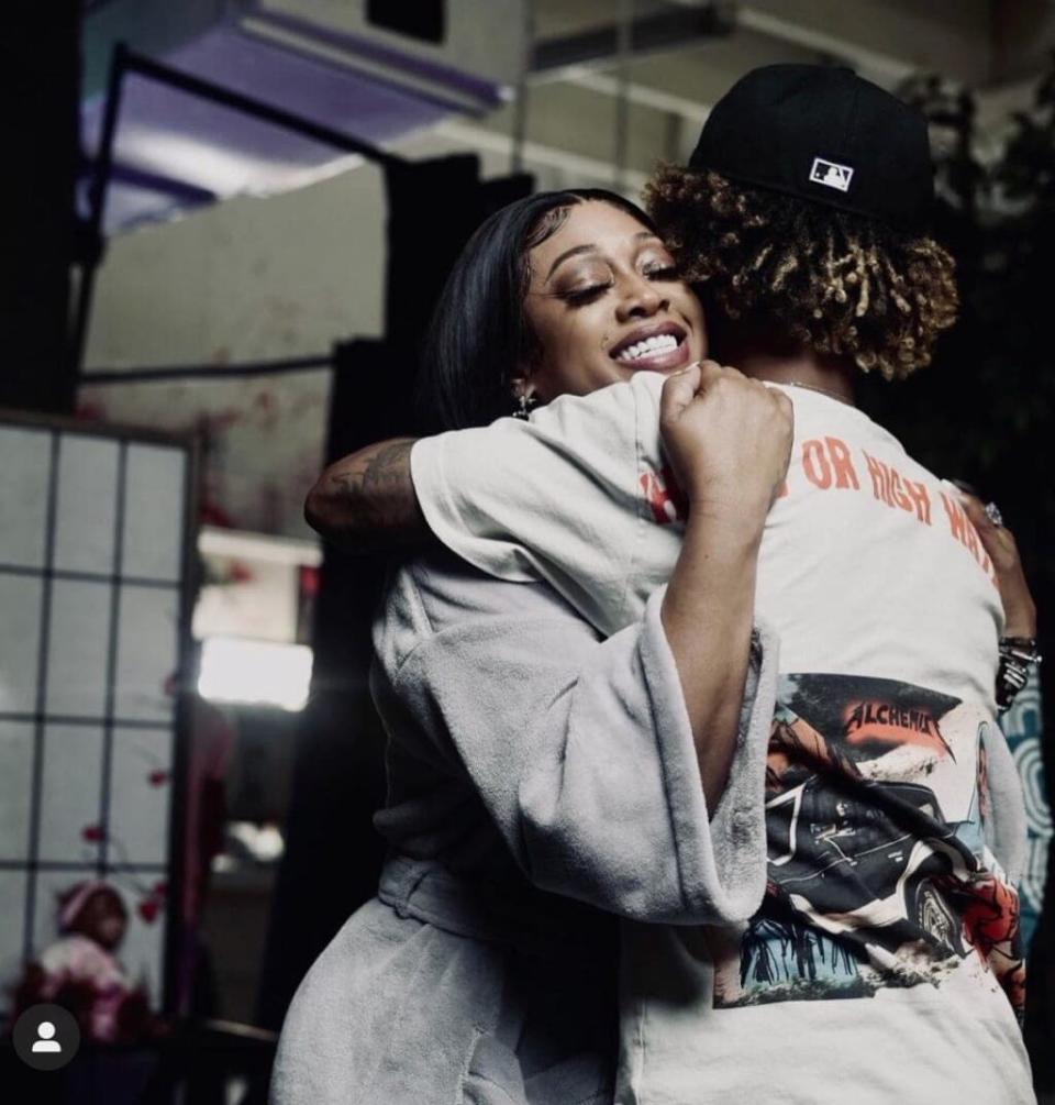 Trina hugs fiancé Raymond Taylor, a Miami-based rapper, in a photo shared to Instagram.