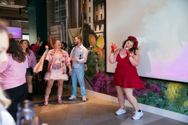 Emily Newton (right) belts out 