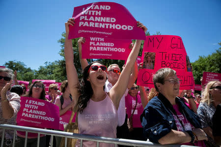 Claire Contreras, 30, reacts as she listens to Former State Senator Wendy Davis speak during a Planned Parenthood rally outside the State Capitol in Austin, Texas, U.S., April 5, 2017. REUTERS/Ilana Panich-Linsman