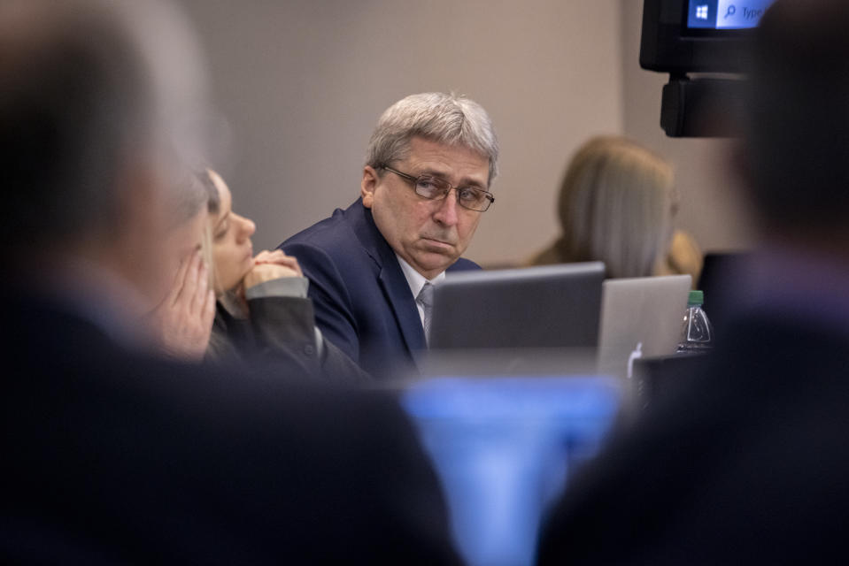 William "Roddie" Bryan, center, listens to arguments during the trial of he, Greg McMichael and Travis McMichael in the Glynn County Courthouse, Tuesday, Nov. 9, 2021, in Brunswick, Ga. The three are charged with the February 2020 slaying of 25-year-old Ahmaud Arbery. (AP Photo/Stephen B. Morton, Pool)