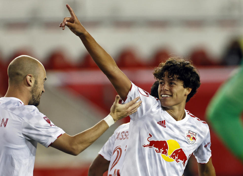 FILE - New York Red Bulls midfielder Caden Clark (37) reacts after scoring a goal against the Sporting Kansas City during an MLS soccer match in Harrison, N.J., Saturday, April 17, 2021. Clark made a splash in MLS at just 17 when her scored in his Red Bulls debut. (AP Photo/Adam Hunger, File)