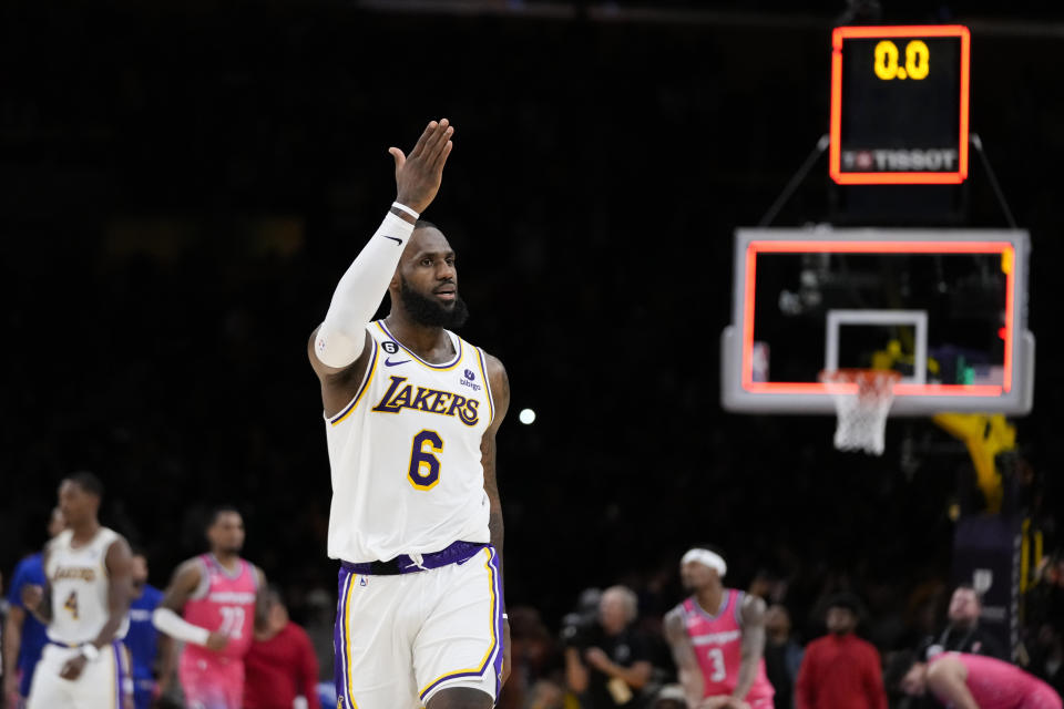 Los Angeles Lakers' LeBron James (6) acknowledges fans after the team's win over the Washington Wizards in an NBA basketball game Sunday, Dec. 18, 2022, in Los Angeles. (AP Photo/Jae C. Hong)