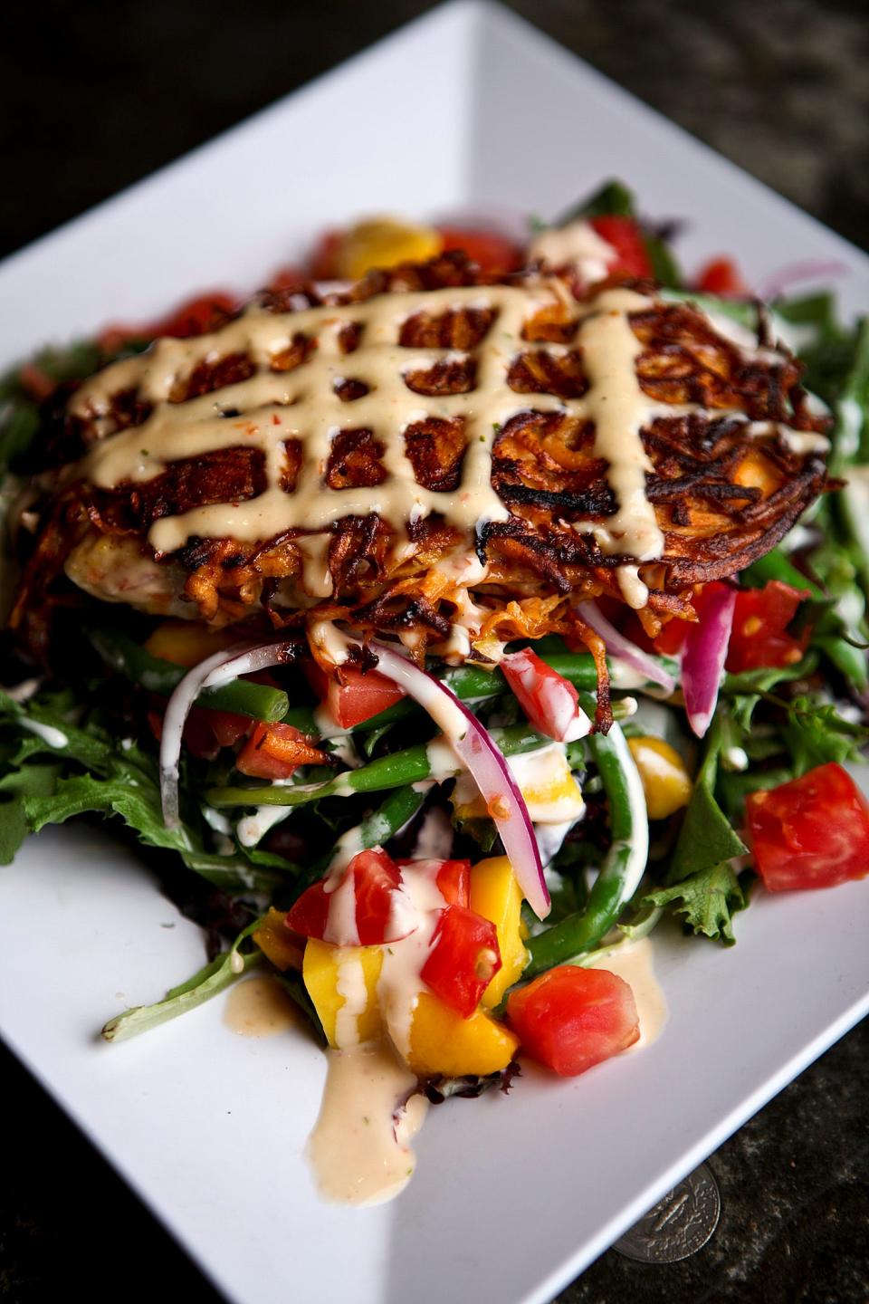 Sweet potato-crusted fish (wahoo is shown here) is a signature dish at Little Moir's Leftovers Café and Food Shack restaurants. 