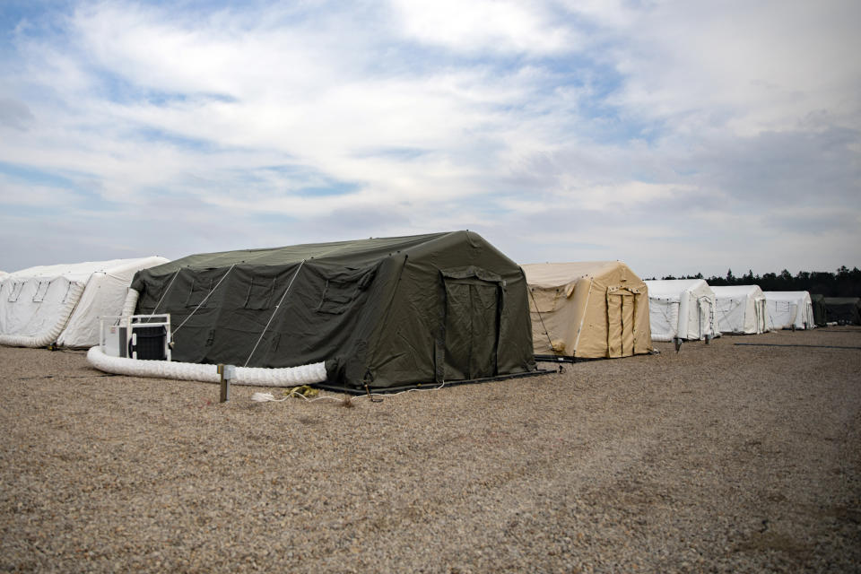 This photo provided by the U.S. Army shows large tents The 82nd Airborne Division has established to provide accommodations for up to 600 soldiers, shown March 17, 2020 at Fort Bragg, N.C. In one of Bragg's remote training areas, large tents have popped up over the last few days to house hundreds of 82nd Airborne Division troops that are returning to the base from Afghanistan and other Middle East deployments. (U.S. Army photo by Sgt. 1st Class Zach VanDyke via AP)