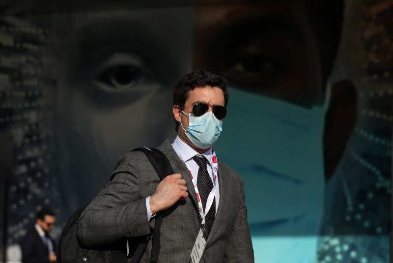 A vistor wears a mask during the Arab Health Exhibition in Dubai,