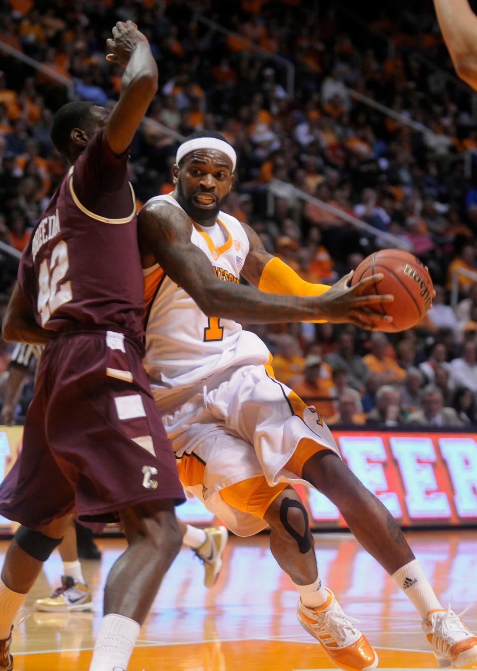 Tennessee guard Tyler Smith works around College of Charleston forward Casaan Breeden, Nov. 27, 2009. The Vols won, 86-69.