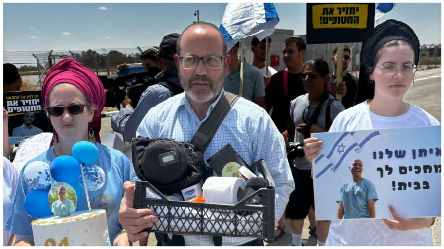 <sup>Tzvika Mor, the father of Eitan Mor, held hostage by Hamas in the Gaza Strip for nearly 240 days, speaks to reporters at the Kerem Shalom border cross on May 30, 2024. (Laura Kelly)</sup>