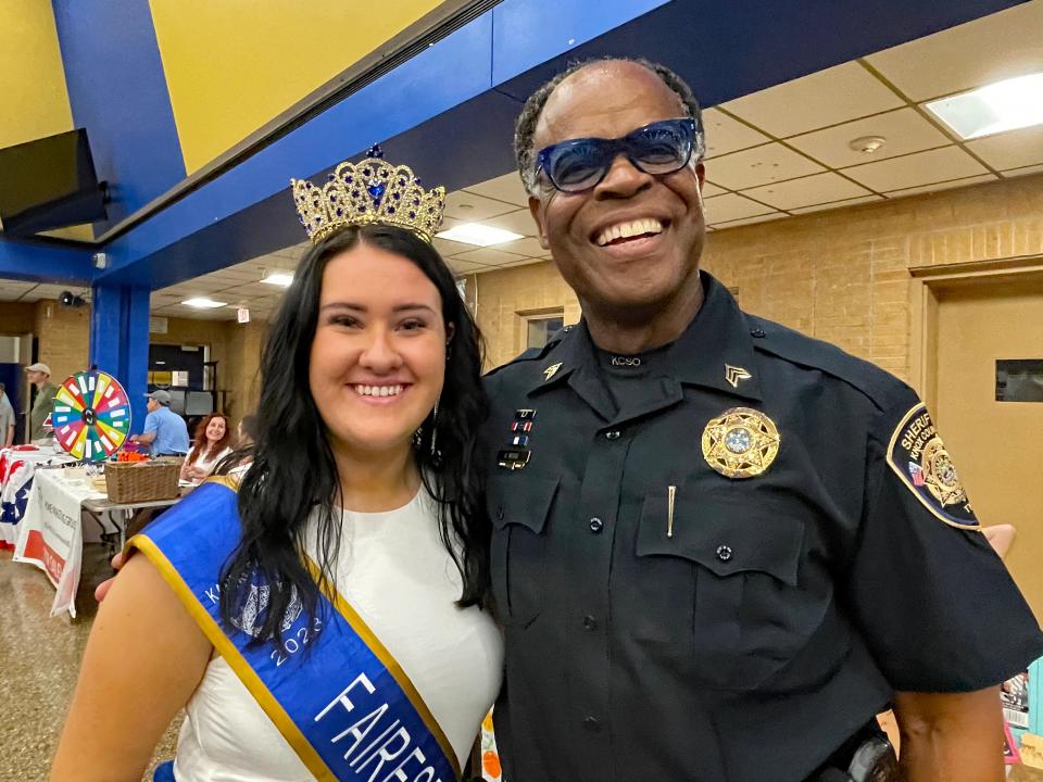 Newly minted Miss Fairest of the Fair Madison Clabough seems to enjoy meeting the community, including longtime fair participant Knox County Officer Sgt. Glenwood White, at the 70th annual Karns Community Fair at Karns High School on July 15, 2023.