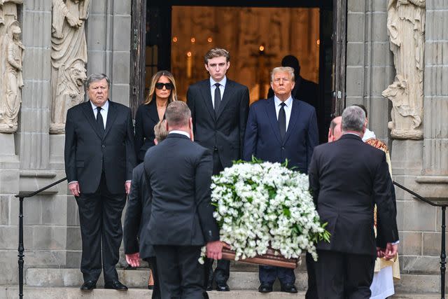 <p>GIORGIO VIERA/AFP via Getty</p> Viktor Knavs, Melania Trump, Barron Trump and Donald Trump greet the casket of Melania's mother, Amalija Knavs, on Jan. 18, 2024