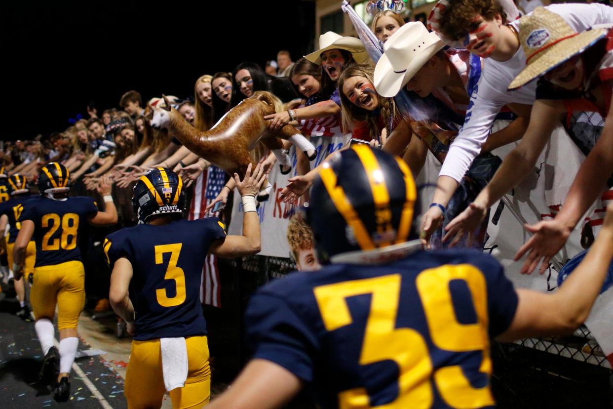 Prince Avenue football players celebrate with their student section after an GHSA high school football between Holy Innocents Episcopal and Prince Avenue in Bogart, Ga., on Friday Sept. 10, 2021. Prince Avenue won 49-0.