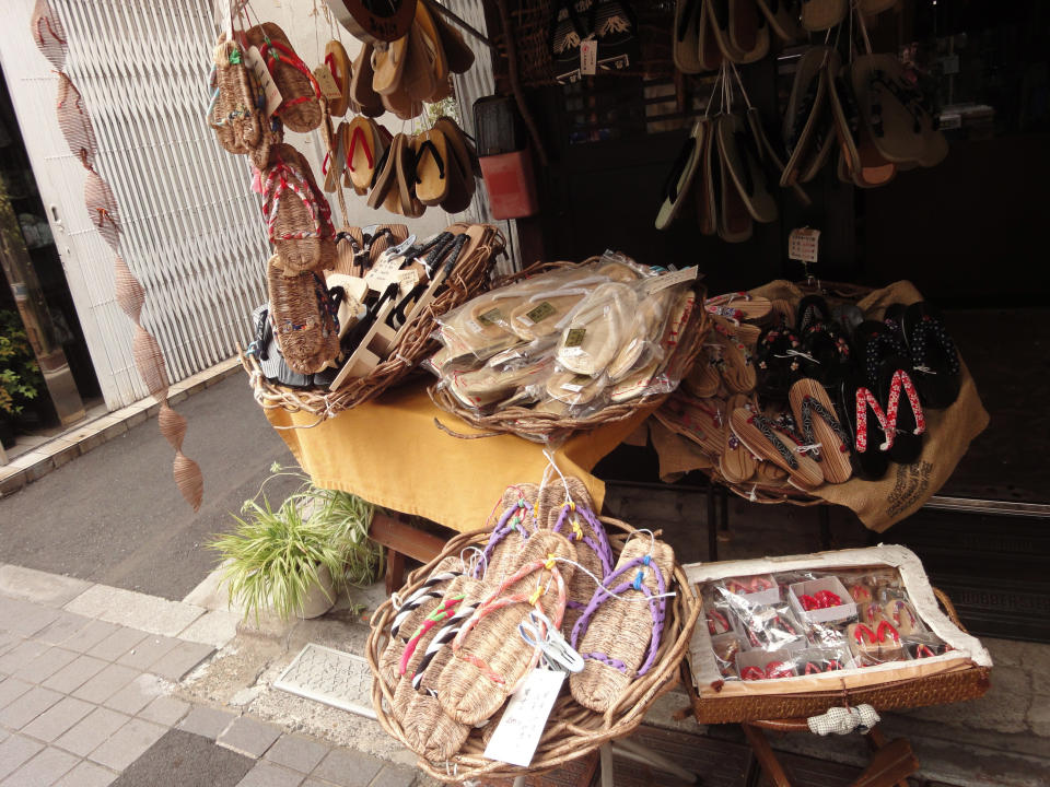 This Oct. 22, 2013 photo shows the display in front of a shop in the Yanaka neighborhood of Tokyo. This shop on the Yanaka Ginza shopping street sells traditional wooden and rope sandals. (AP Photo/Linda Lombardi)