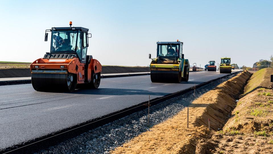 Road rollers building the new asphalt road.