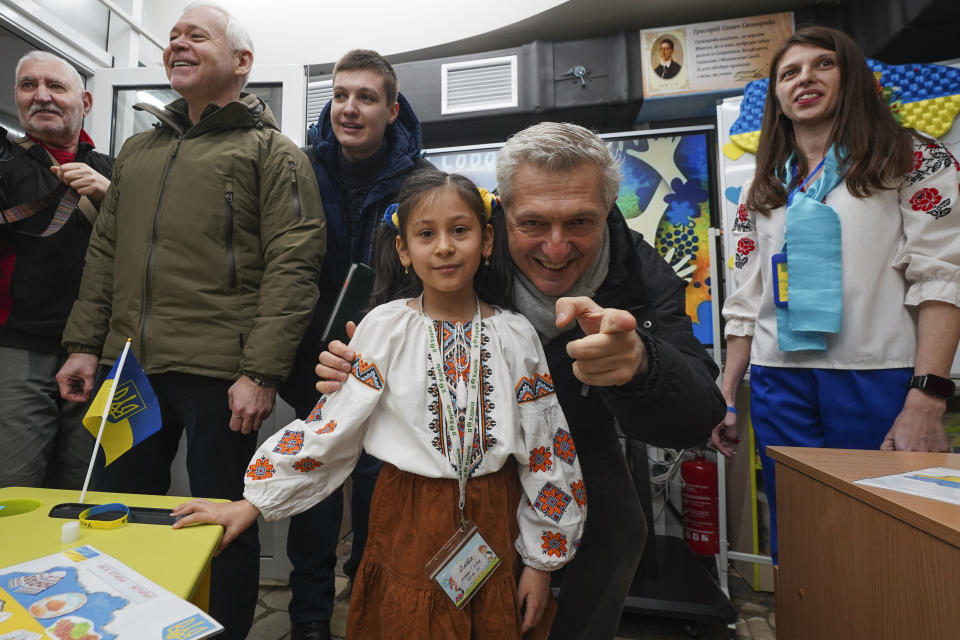 CORRECTS SPELLING OF SURNAME TO GRANDI - United Nations High Commissioner for Refugees Filippo Grandi poses for a photo with a pupil as he visits a school in Kharkiv, Ukraine, Monday, Jan. 22, 2024. (AP Photo/Andrii Marienko)