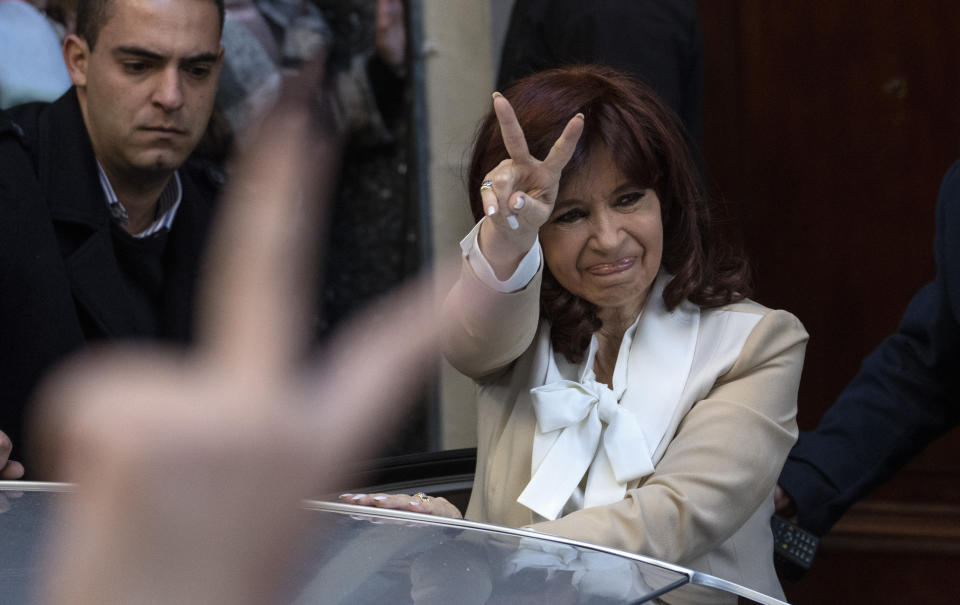 FILE - Argentine Vice President Cristina Fernandez greets supporters as she leaves her home in Buenos Aires, Argentina, Tuesday, Aug. 23, 2022. Every day for the past two weeks, Fernandez was met by a crowd of feverish supporters after a prosecutor sought to send her to prison for 12 years over corruption allegations involving public works while she was president from 2007 to 2015. (AP Photo/Rodrigo Abd, File)