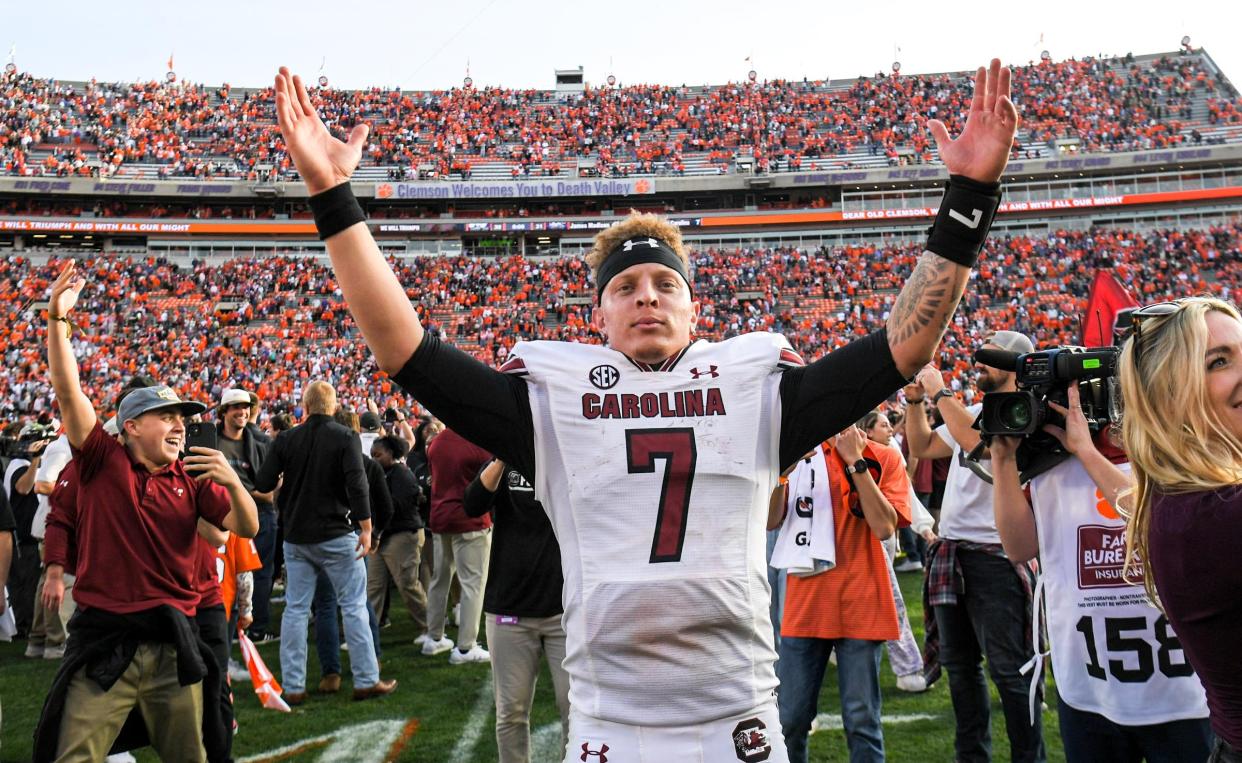 South Carolina quarterback Spencer Rattler (7) celebrates after the game with Clemson at Memorial Stadium in Clemson, South Carolina Saturday, Nov. 26, 2022.