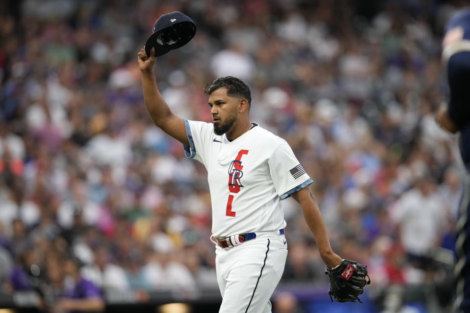 National League's German Marquez, of the Colorado Rockies, tips his cap to the home crowd after pitching during the fourth inning of the MLB All-Star baseball game, Tuesday, July 13, 2021, in Denver. (AP Photo/David Zalubowski)