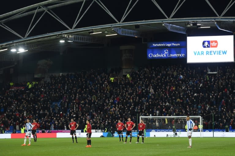 Not so instant replay: Players wait for the VAR decision on Juan Mata's 'goal' which was ruled out