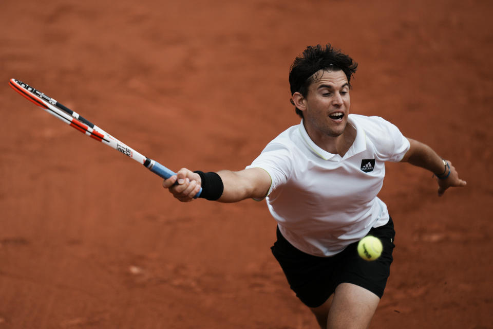 Austria's Dominic Thiem plays a shot against Bolivia's Hugo Dellien during their first round match at the French Open tennis tournament in Roland Garros stadium in Paris, France, Sunday, May 22, 2022. (AP Photo/Thibault Camus)