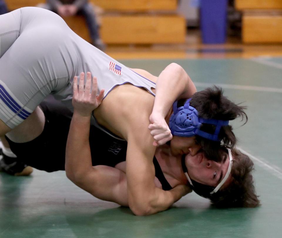 Kyle Peske of Hendrick Hudson and Charlie Howley of Putnam Valley battle in a 189 pound match during a dual wrestling meet at Pleasantville High School Dec. 13, 2022. 