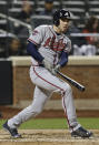 Atlanta Braves' Freddie Freeman follows through on a double during the ninth inning of a baseball game against the New York Mets, Friday, April 18, 2014, in New York. (AP Photo/Frank Franklin II)