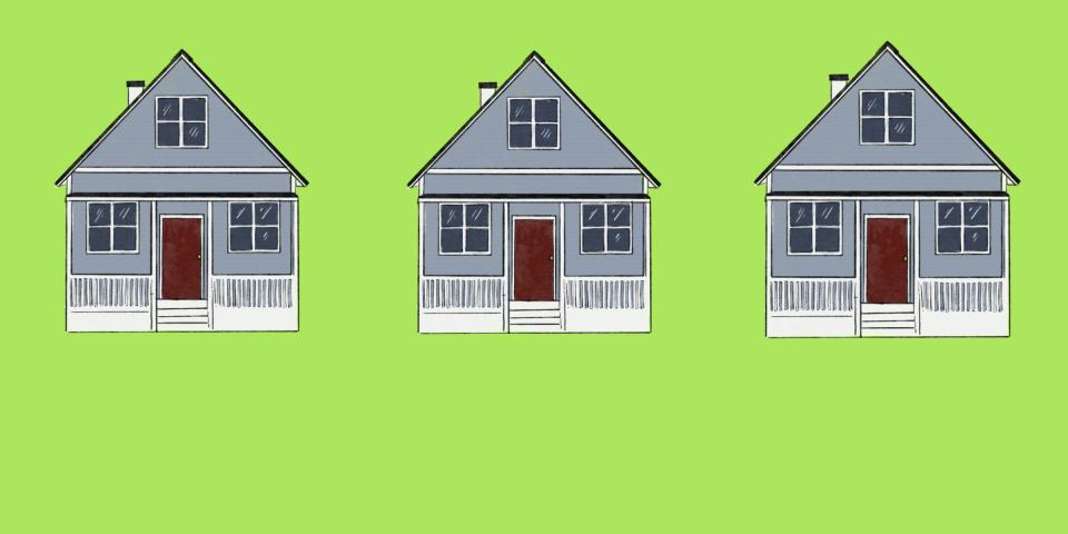 For rent signs featuring logos for Google, Meta, and Tesla pop up in front of a row of gray two-story houses.