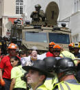 <p>Rescue personnel help injured people after a car ran into a large group of protesters after an white nationalist rally in Charlottesville, Va., Saturday, Aug. 12, 2017. (Photo: Steve Helber/AP) </p>