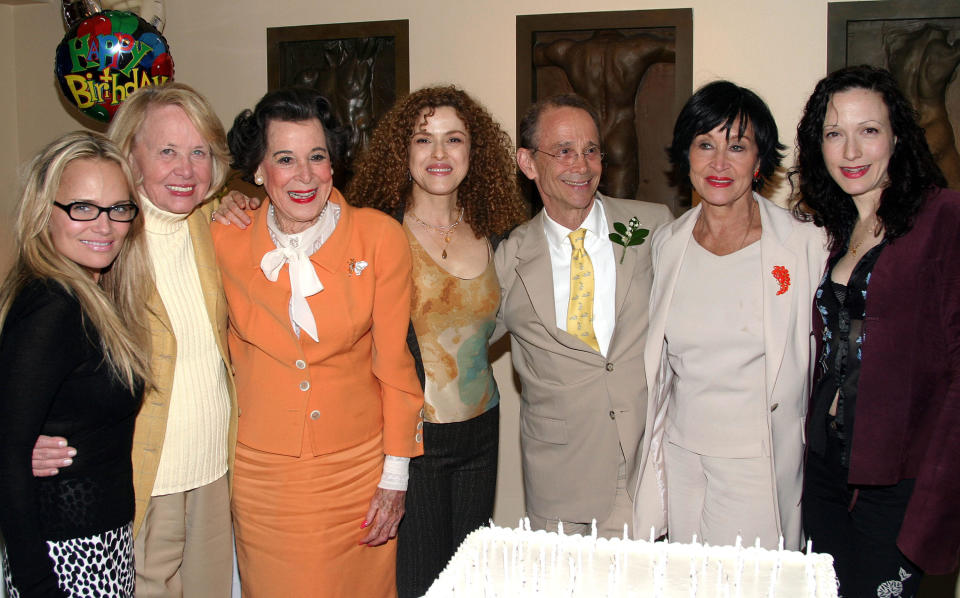 Kristin Chenoweth, Liz Smith, Kitty Carlisle Hart, Bernadette Peters, Joel Grey, Chita Rivera and Bebe Neuwirth at Grey's birthday party in 2004. / Credit: Bruce Glikas/FilmMagic