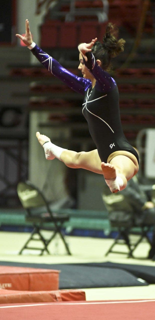 Bloomington South's Maddie Kawanishi competes in the floor exercise during the IHSAA state gymnastics meet at Ball State on Saturday, March 11, 2023.