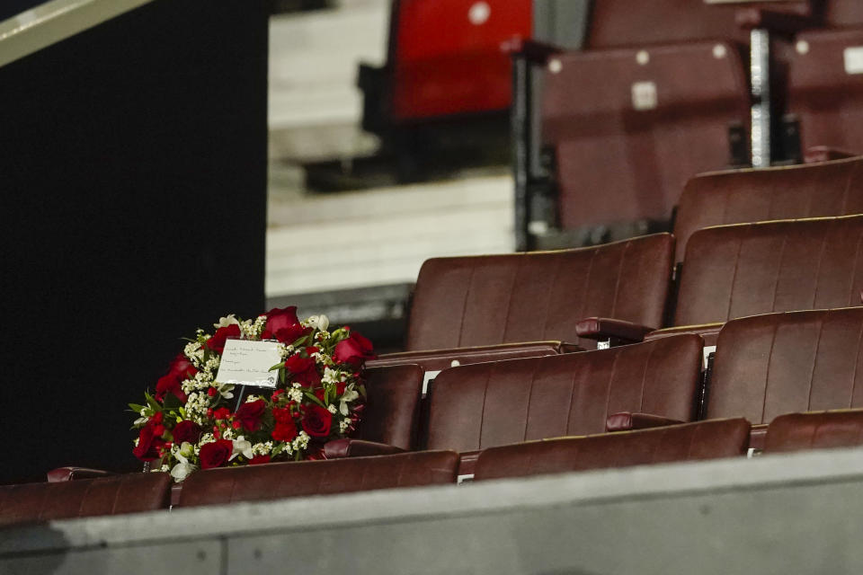 Flowers rest on a seat in honor of Sir Bobby Charlton is seen prior the Champions League group A soccer match between Manchester United and Copenhagen at the Old Trafford stadium in Manchester, England, Tuesday, Oct. 24, 2023. Manchester United and England soccer great Bobby Charlton has died at the age of 86. He was an English soccer icon who survived a plane crash that decimated a United team destined for greatness to become the heartbeat of his country's 1966 World Cup-winning team. (AP Photo/Dave Thompson)