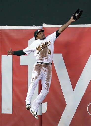 Coco Crisp's leaping catch at the wall gave the A's all the momentum they needed. (AP)