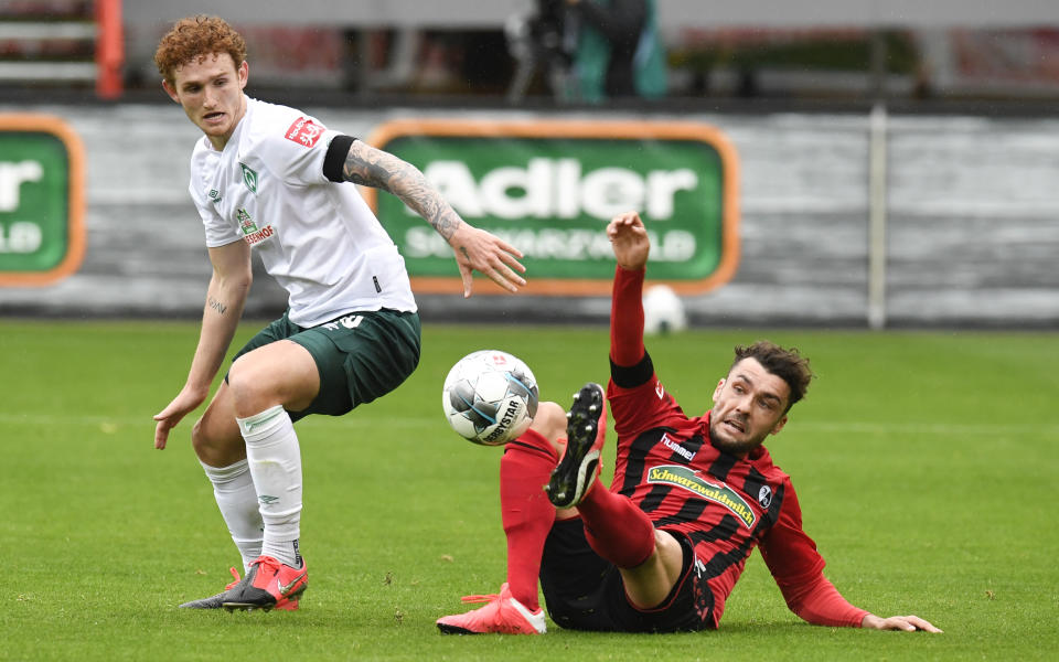 In his first start since the Bundesliga's return, American striker Josh Sargent (left) helped relegation-threatened Werder Bremen secure a crucial win. (Thomas Kienzle/Getty Images)