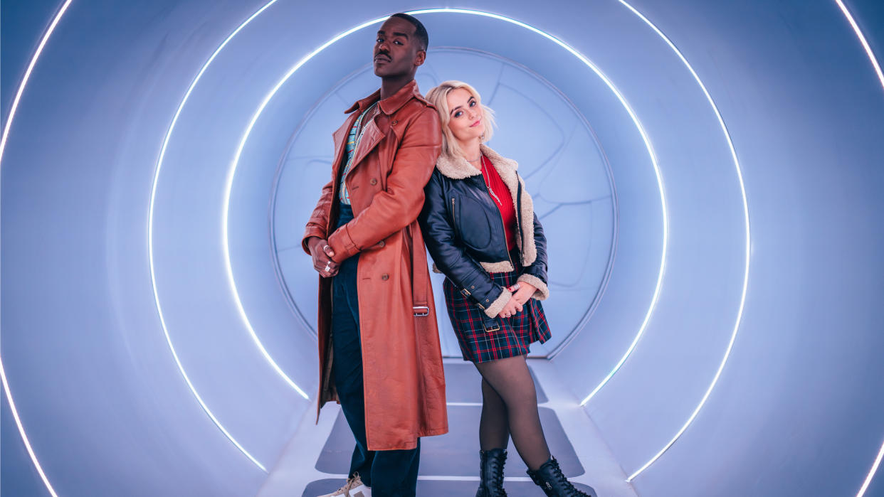  The Doctor (Ncuti Gatwa) and Ruby Sunday (Millie Gibson) photographed standing back-to-back inside the TARDIS in Doctor Who season 14. 