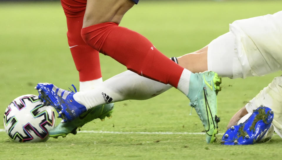 Germany's Mats Hummels, right, challenges France's Kylian Mbappe during the Euro 2020 soccer championship group F match between Germany and France at the Allianz Arena stadium in Munich, Tuesday, June 15, 2021. (Franck Fife/Pool via AP)