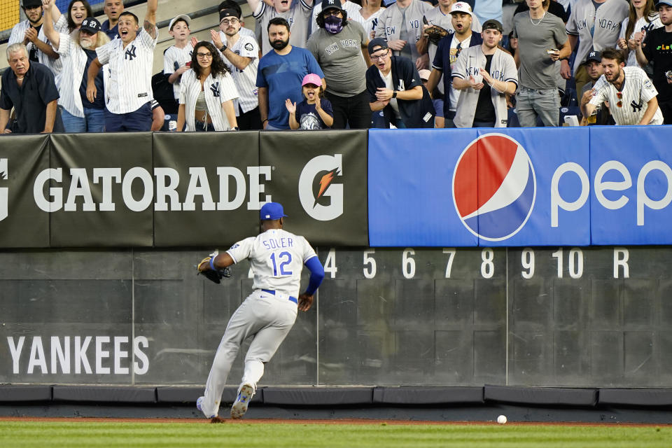 Kansas City Royals right fielder Jorge Soler (12) chases down Clint Frazier's two-run double during the fourth inning of a baseball game against the New York Yankees, Wednesday, June 23, 2021, at Yankee Stadium in New York. (AP Photo/Kathy Willens)