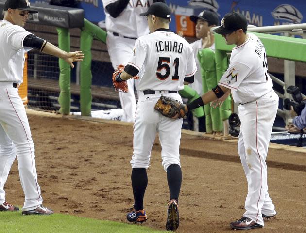 Ichiro Suzuki's congratulate him after his remarkable outfield assist. (AP)