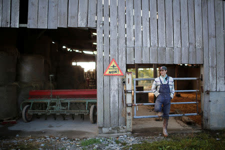 French farmer Willem poses at the "Saint-Jean-du-Tertre" area in the zoned ZAD (Deferred Development Zone) in Notre-Dame-des-Landes, that is slated for the Grand Ouest Airport (AGO), western France, October 17,2016. The sign reads "Airport No". Picture taken October 17, 2016. REUTERS/Stephane Mahe