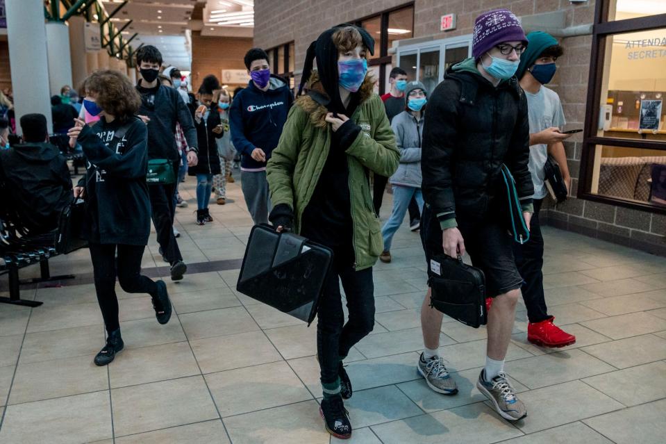 Students walk to class on Thursday, Dec. 9, 2021, at Lakeview High School in Battle Creek, Michigan.