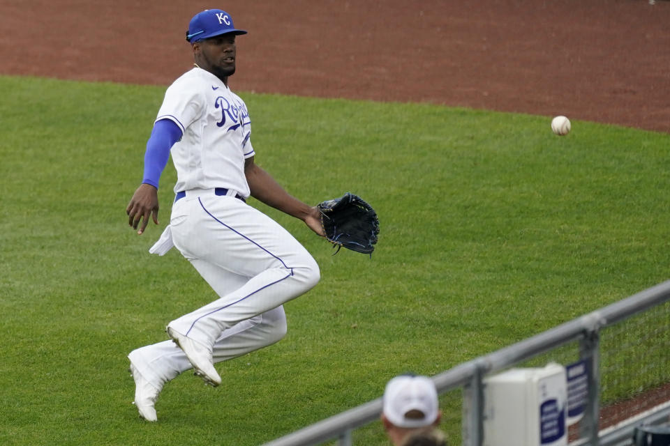 Kansas City Royals right fielder Jorge Soler chases after an RBI triple hit by Chicago White Sox's Leury Garcia during the first inning of a baseball game Saturday, May 8, 2021, in Kansas City, Mo. (AP Photo/Charlie Riedel)