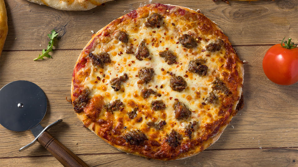 A recipe for Sausage Pepita Pizza using sun dried tomato pesto