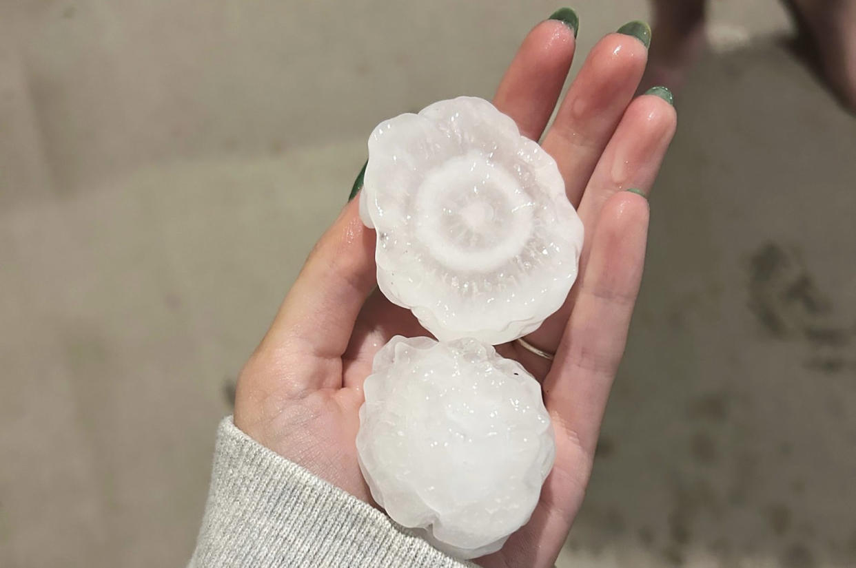 Volatile weather was honing in on parts of Kansas and Missouri Wednesday night, with some storms bringing massive chunks of hail. (Jeremy Crabtree / AP)