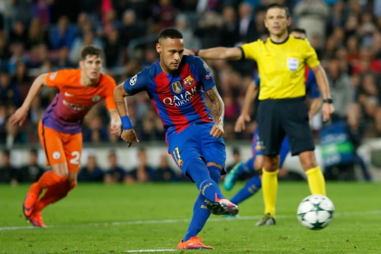 Barcelona's forward Neymar shoots a penalty kick during the UEFA Champions League football match FC Barcelona vs Manchester City at the Camp Nou stadium in Barcelona on October 19, 2016