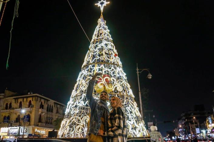 The streets and buildings of the Heliopolis district are decorated with lights and Christmas trees to celebrate the New Year in Egypt, Cairo, December 23, 2021