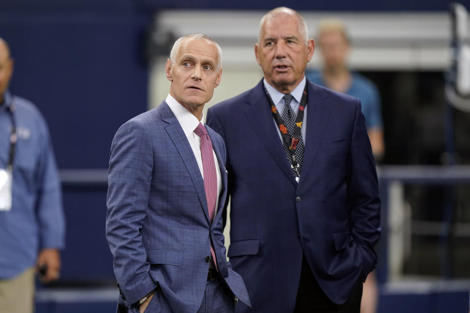 Incoming Big 12 Commissioner Brett Yormark, left, stands with outgoing Commissioner Bob Bowlsby at the NCAA college football Big 12 media days in Arlington, Texas, Thursday, July 14, 2022. (AP Photo/LM Otero)