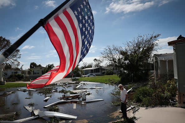 PUNTA GORDA, FLORIDA - SEPTEMBER 29: Tom Park begins cleaning up after Hurricane Ian moved through the Gulf Coast of Florida on September 29, 2022 in Punta Gorda, Florida. The hurricane brought high winds, storm surge and rain to the area causing severe damage. (Photo by Win McNamee/Getty Images)