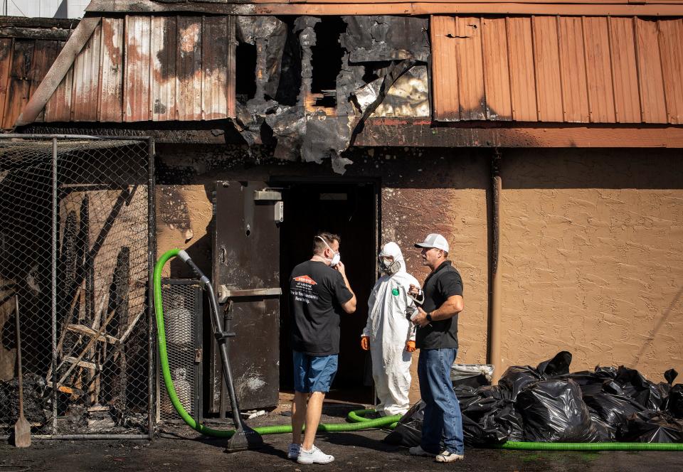Cleanup crews work inside the Texas Cattle Company restaurant in Lakeland, FL, Tuesday February 7, 2023. Lakeland Fire Department responded to a report of a fire at the restaurant about 1 a.m. and could see heavy flames and smoke from the south side of the building at 735 E. Main St.