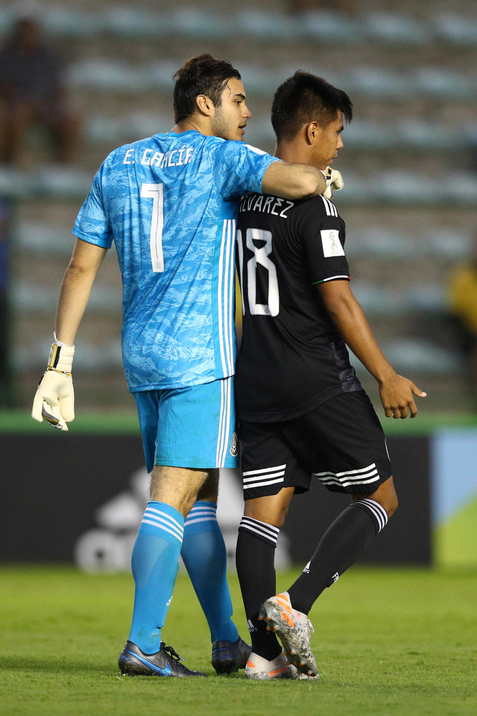 BRASILIA, BRAZIL - NOVEMBER 14:  Eduardo Garcia of Mexico celebrates with his team-mate Efrain Alvarez during a penalty shootout  during the FIFA U-17 World Cup Brazil 2019 semi-final match between Mexico and the Netherlands at Estadio Bezerrao on November 14, 2019 in Brasilia, Brazil. (Photo by Buda Mendes - FIFA/FIFA via Getty Images)